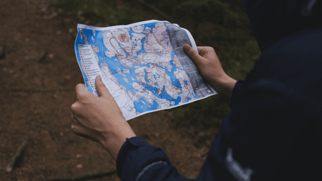 Lady holding and looking at a map